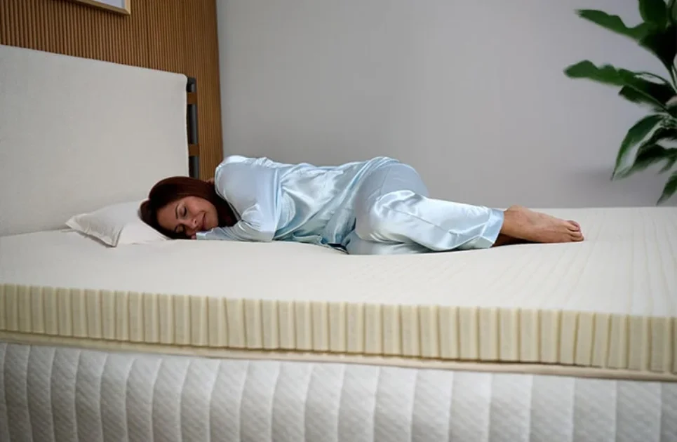 woman sleeping on a latex mattress topper